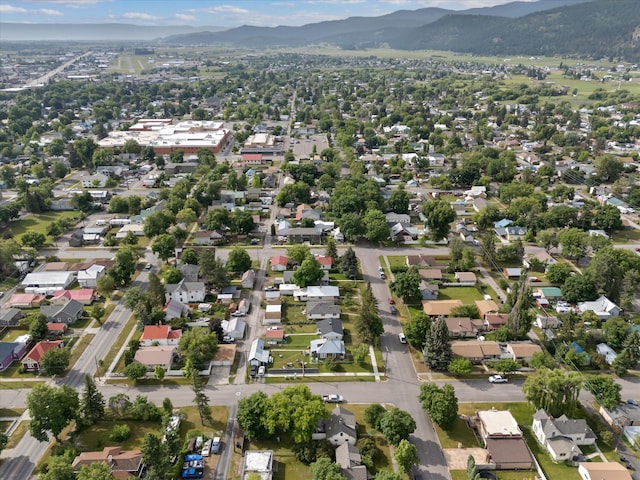 321 6th Ave W, Kalispell, MT 59901 - aerial overview of property's location featuring mountains and nearby suburban area
