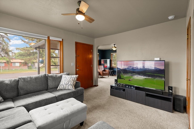 321 6th Ave W, Kalispell, MT 59901 - living room with ceiling fan, carpet flooring, and arched walkways