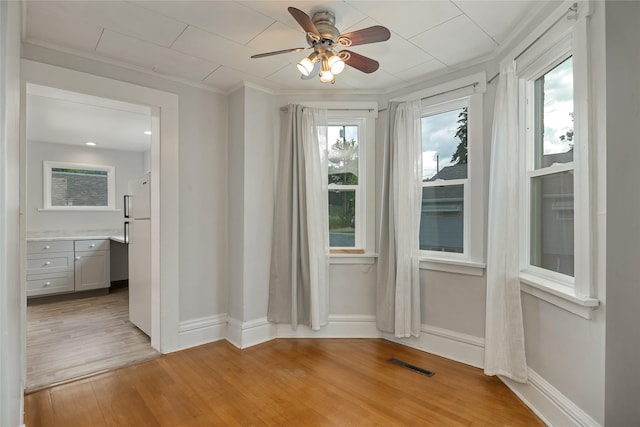 541 5th Ave, Helena, MT 59601 - unfurnished room featuring ceiling fan, light wood-type flooring, and ornamental molding