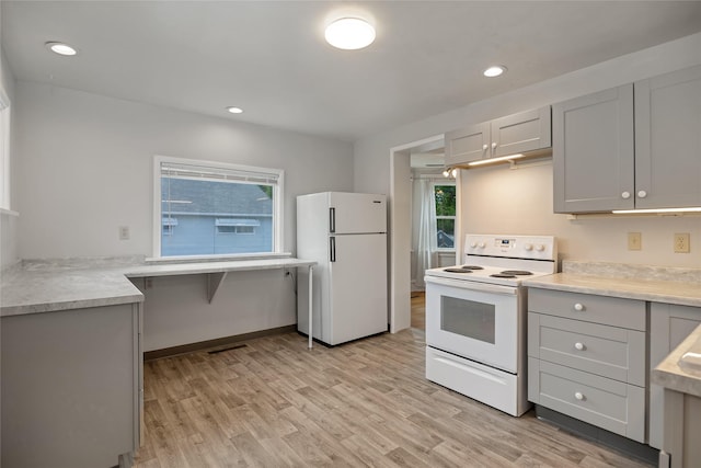 541 5th Ave, Helena, MT 59601 - kitchen with white appliances, light wood-style flooring, light countertops, and recessed lighting