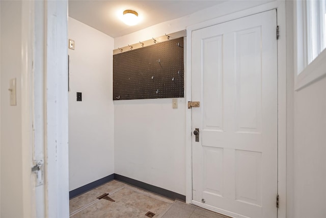 541 5th Ave, Helena, MT 59601 - doorway with baseboards and light tile patterned flooring
