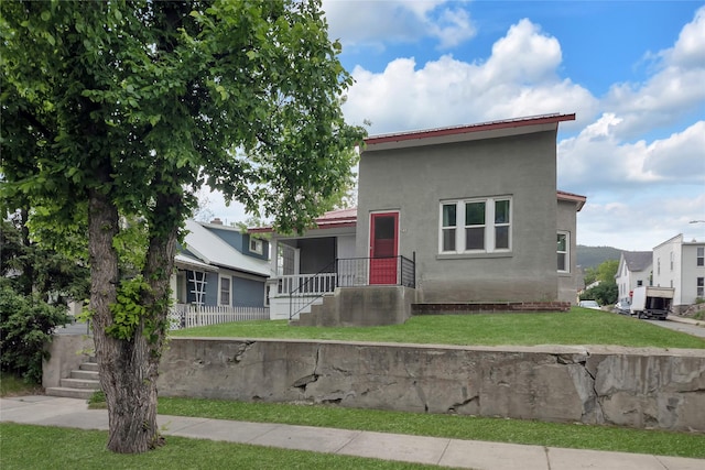 541 5th Ave, Helena, MT 59601 - view of front of home with a front lawn and stucco siding