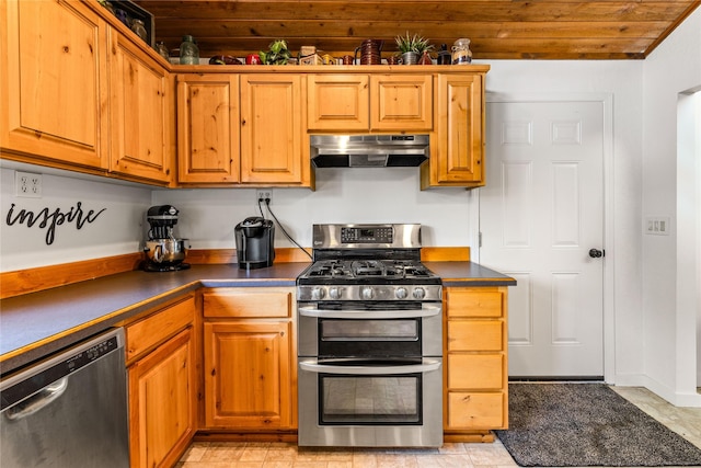 4291 Williams Ln, Stevensville, MT 59870 - kitchen with stainless steel appliances, under cabinet range hood, dark countertops, wooden ceiling, and brown cabinetry