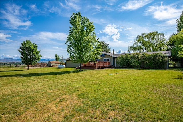 4291 Williams Ln, Stevensville, MT 59870 - view of green lawn featuring a wooden deck and a shed