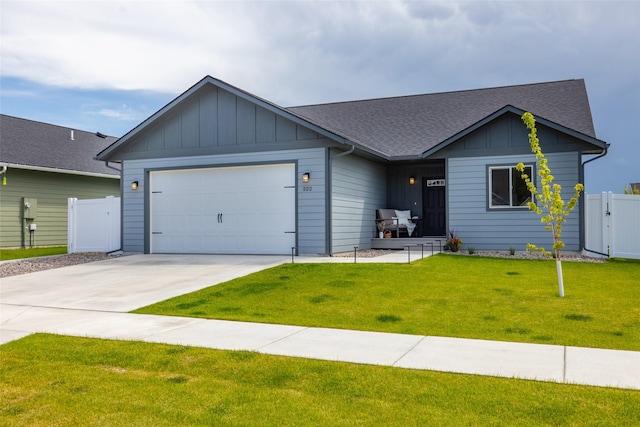 522 Pheasant Ln, Kalispell, MT 59901 - ranch-style house featuring board and batten siding, concrete driveway, roof with shingles, and a garage