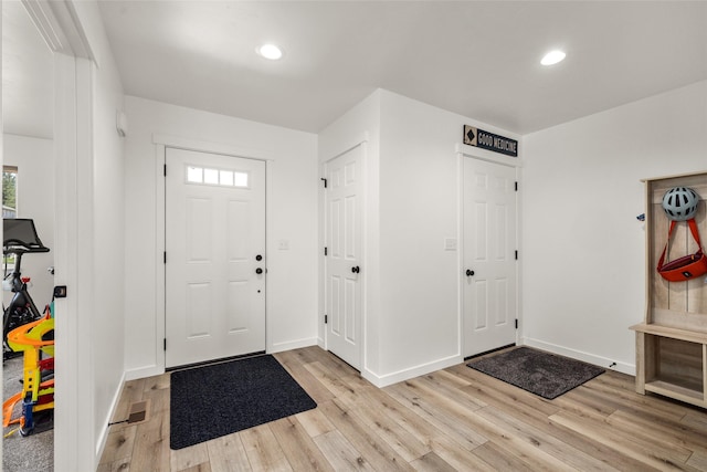 522 Pheasant Ln, Kalispell, MT 59901 - entrance foyer with light wood finished floors, healthy amount of natural light, and recessed lighting