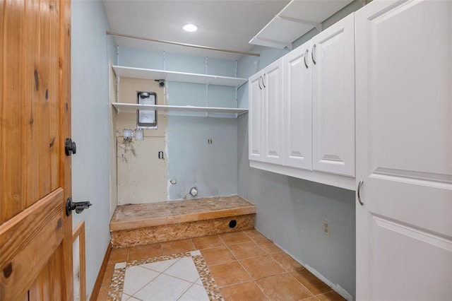 8340 Green Meadow Dr, Helena, MT 59602 - laundry area featuring light tile patterned floors, hookup for an electric dryer, cabinet space, and recessed lighting