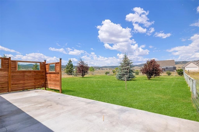 8340 Green Meadow Dr, Helena, MT 59602 - fenced backyard featuring a patio area