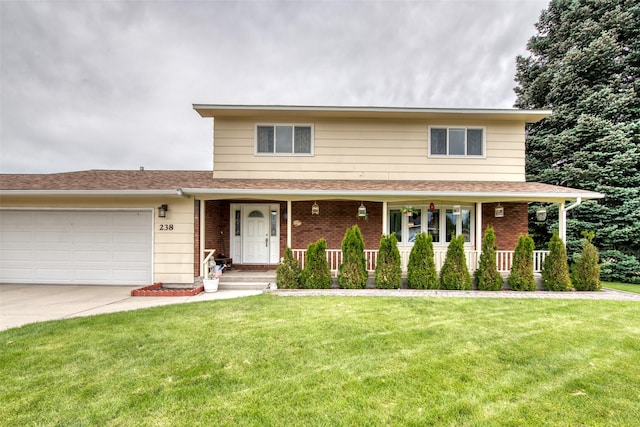 238 Hillcrest Dr, Hamilton, MT 59840 - traditional home featuring brick siding, an attached garage, driveway, and a front yard