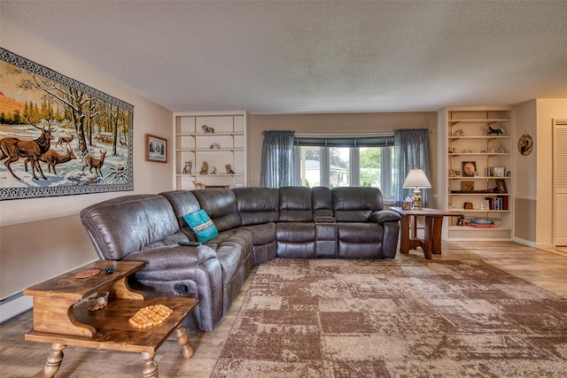 238 Hillcrest Dr, Hamilton, MT 59840 - living area with a textured ceiling, built in shelves, and wood finished floors