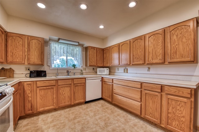 238 Hillcrest Dr, Hamilton, MT 59840 - kitchen with white appliances, recessed lighting, light countertops, and brown cabinets