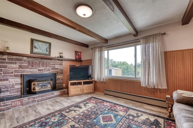 238 Hillcrest Dr, Hamilton, MT 59840 - living area featuring baseboard heating, a textured ceiling, light wood-style floors, beam ceiling, and wooden walls