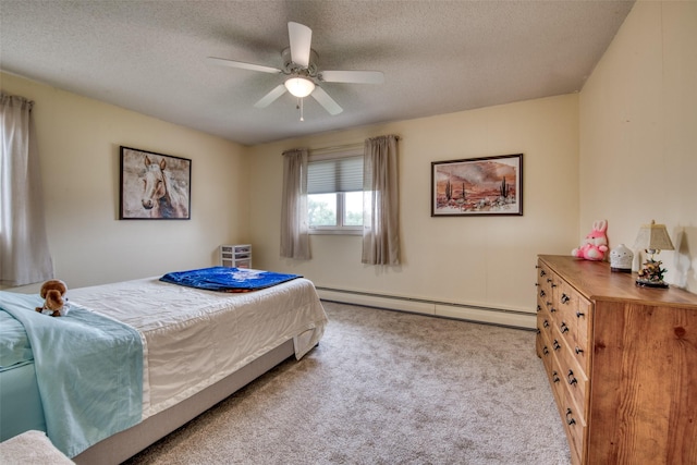 238 Hillcrest Dr, Hamilton, MT 59840 - bedroom with baseboard heating, carpet floors, a textured ceiling, and ceiling fan