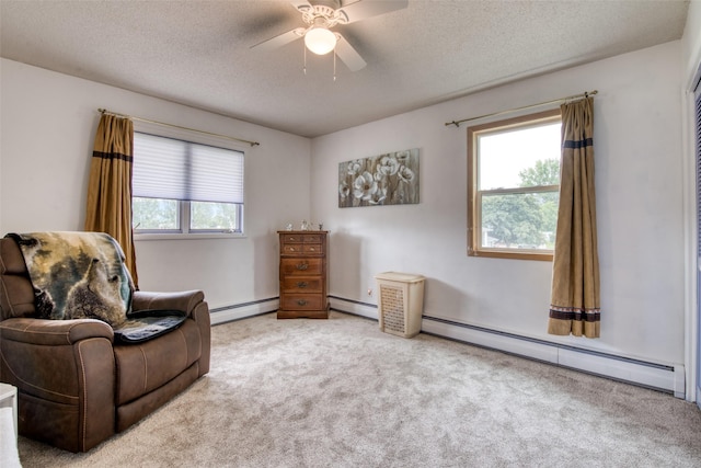 238 Hillcrest Dr, Hamilton, MT 59840 - living area featuring baseboard heating, carpet flooring, a textured ceiling, and ceiling fan