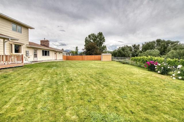 238 Hillcrest Dr, Hamilton, MT 59840 - fenced backyard with a storage shed and a deck