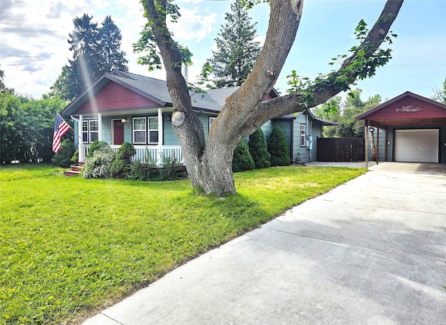 1109 W Main St, Hamilton, MT 59840 - view of front of house featuring driveway, covered porch, an outbuilding, and a detached garage