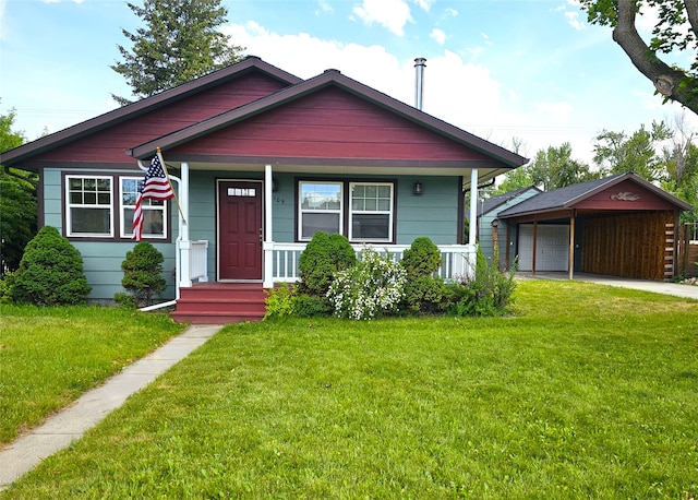 1109 W Main St, Hamilton, MT 59840 - bungalow-style home featuring a front lawn, a garage, a porch, and an outdoor structure