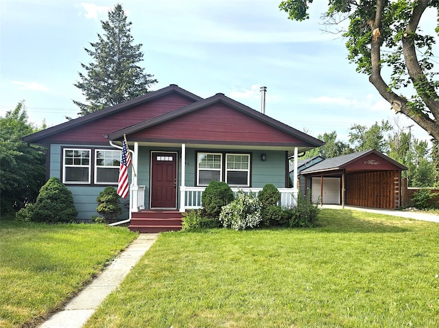 1109 W Main St, Hamilton, MT 59840 - bungalow-style home featuring a porch, a front yard, and an outdoor structure