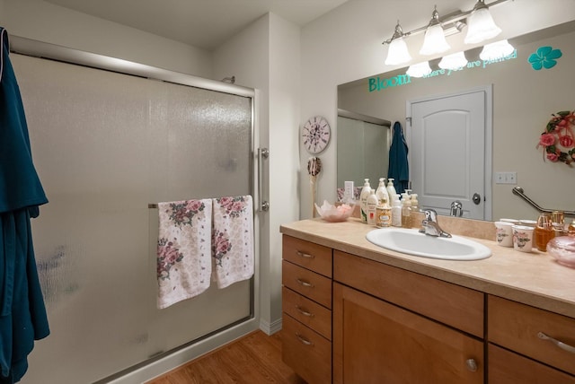36 W Northview Loop, Kalispell, MT 59901 - full bath featuring vanity, a stall shower, and wood finished floors