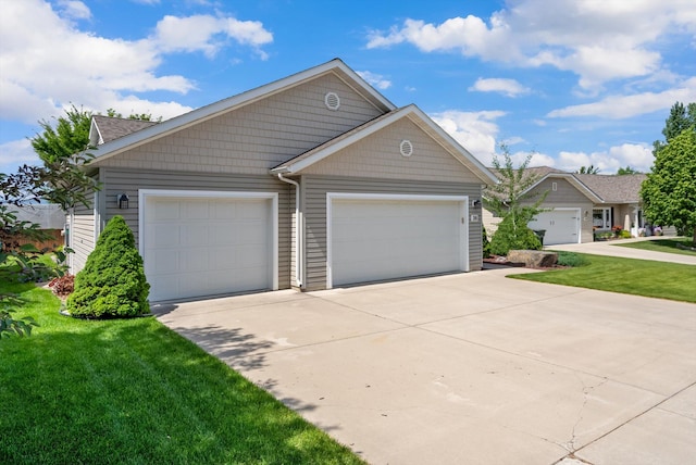 36 W Northview Loop, Kalispell, MT 59901 - view of front of property with driveway, a front yard, and an attached garage