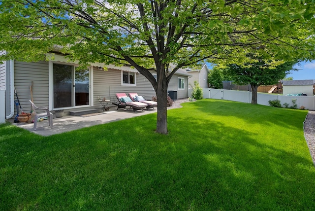 36 W Northview Loop, Kalispell, MT 59901 - fenced backyard with a patio area and entry steps