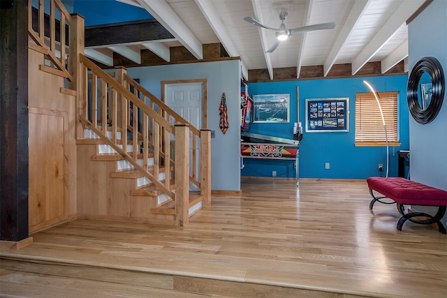2075 Lion Mountain Loop Rd, Whitefish, MT 59937 - stairway with wood finished floors, beam ceiling, and ceiling fan