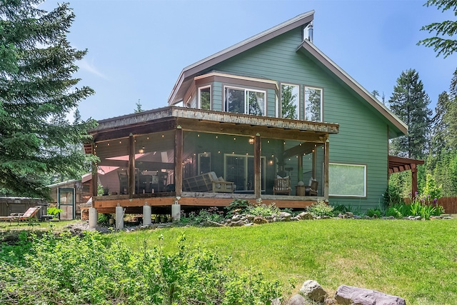2075 Lion Mountain Loop Rd, Whitefish, MT 59937 - back of house featuring a sunroom and a yard