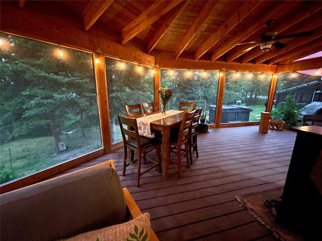 2075 Lion Mountain Loop Rd, Whitefish, MT 59937 - sunroom with a hot tub, beam ceiling, outdoor dining area, and ceiling fan