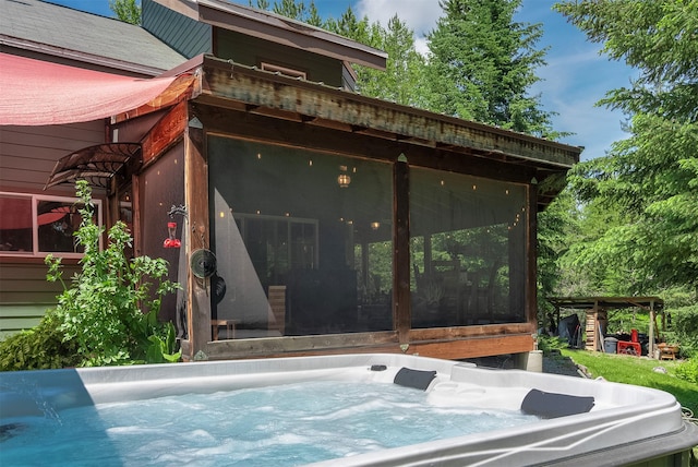 2075 Lion Mountain Loop Rd, Whitefish, MT 59937 - view of side of property featuring a sunroom and a hot tub