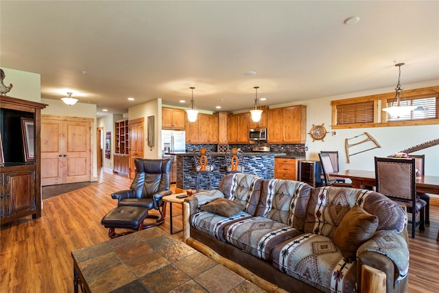 7175 US Highway 93 S Unit 4-102, Lakeside, MT 59922 - living room featuring recessed lighting, wine cooler, and wood finished floors
