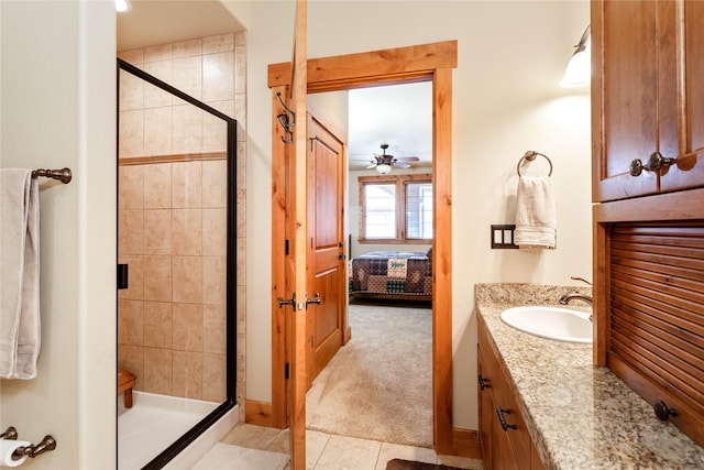 7175 US Highway 93 S Unit 4-102, Lakeside, MT 59922 - ensuite bathroom with a stall shower, vanity, ceiling fan, and tile patterned flooring