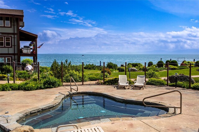 7175 US Highway 93 S Unit 4-102, Lakeside, MT 59922 - outdoor pool with a water view and a patio area