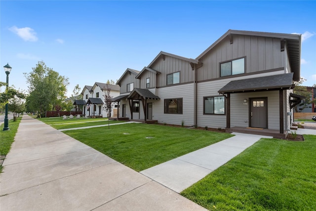 534 Colorado Ave, Whitefish, MT 59937 - view of front of property with board and batten siding, a front lawn, and a residential view