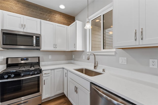 534 Colorado Ave, Whitefish, MT 59937 - kitchen with appliances with stainless steel finishes, white cabinets, light countertops, and recessed lighting