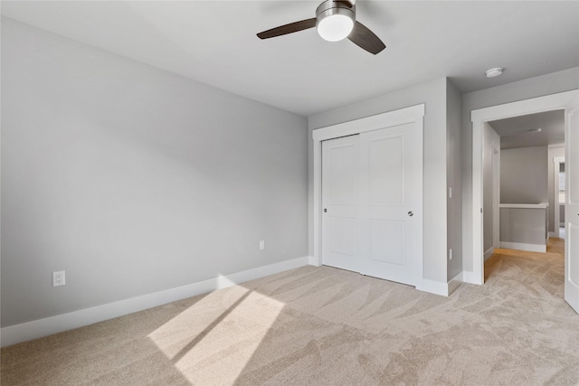 534 Colorado Ave, Whitefish, MT 59937 - unfurnished bedroom featuring light colored carpet, a closet, and a ceiling fan