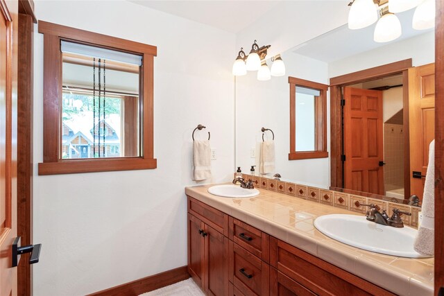 255 Windsor Ct, Bigfork, MT 59911 - bathroom with double vanity and baseboards