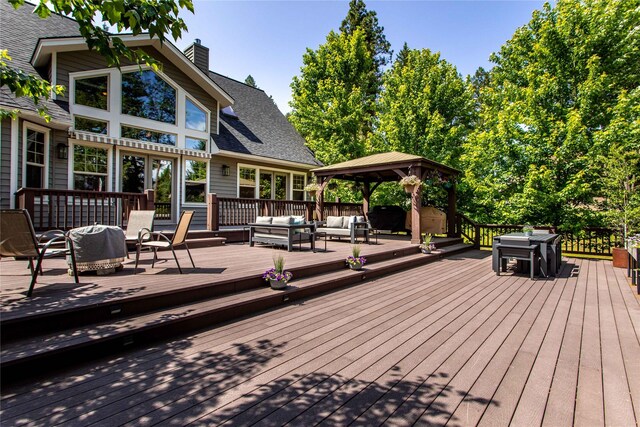 255 Windsor Ct, Bigfork, MT 59911 - deck featuring outdoor lounge area, a gazebo, and outdoor dining area