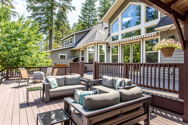 255 Windsor Ct, Bigfork, MT 59911 - wooden terrace with outdoor lounge area and outdoor dining area