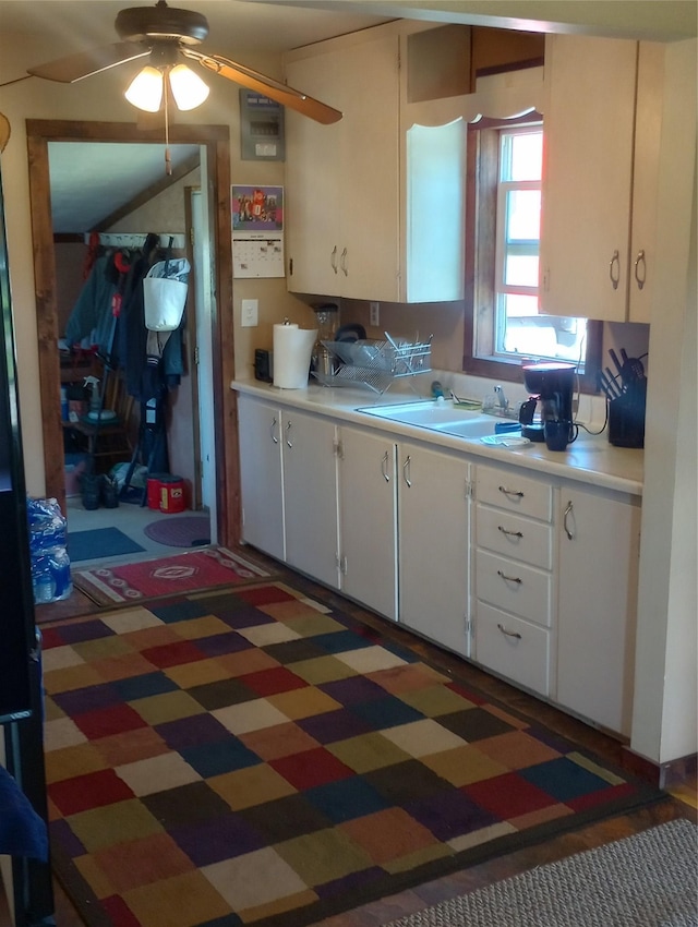 4117 Sherlock Ln, Lincoln, MT 59639 - kitchen featuring light countertops, ceiling fan, white cabinetry, and light floors