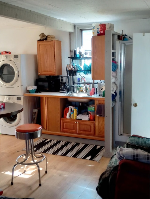 4117 Sherlock Ln, Lincoln, MT 59639 - kitchen featuring estacked washer and dryer and light countertops