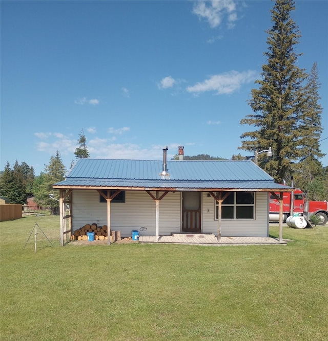 4117 Sherlock Ln, Lincoln, MT 59639 - rear view of property with a metal roof and a porch
