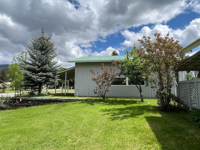 214 Church St, Thompson Falls, MT 59873 - view of grassy yard with a carport