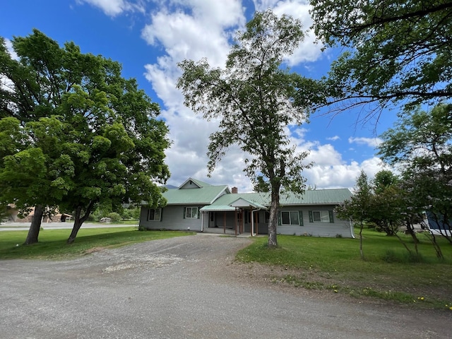 214 Church St, Thompson Falls, MT 59873 - ranch-style house featuring dirt driveway, a front lawn, and a metal roof