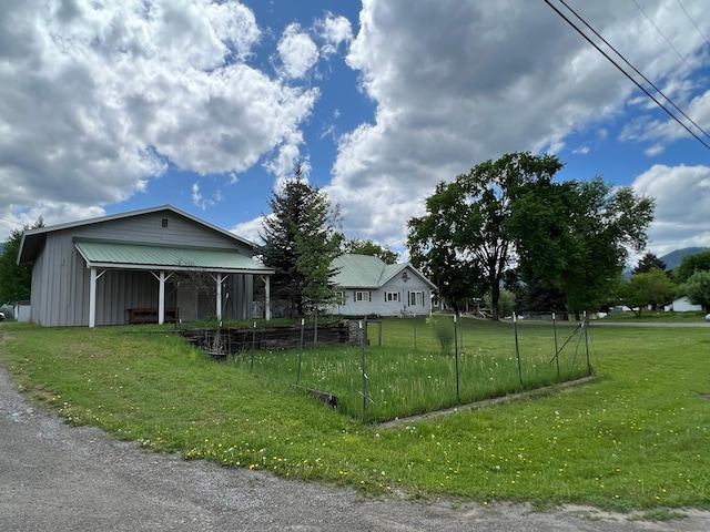 214 Church St, Thompson Falls, MT 59873 - view of front of house featuring board and batten siding and an outbuilding