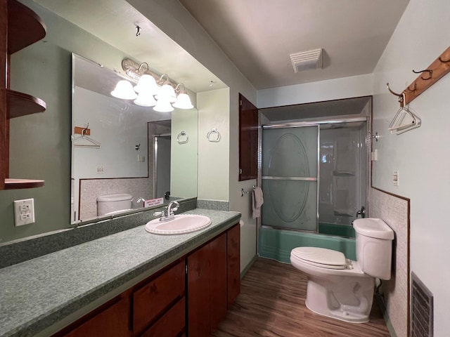 214 Church St, Thompson Falls, MT 59873 - full bath featuring wood finished floors, vanity, and shower / bath combination with glass door