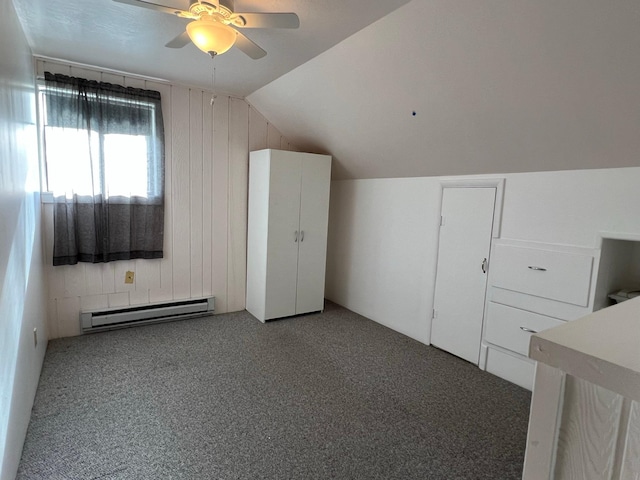 214 Church St, Thompson Falls, MT 59873 - bonus room with a baseboard radiator, ceiling fan, lofted ceiling, wooden walls, and carpet flooring