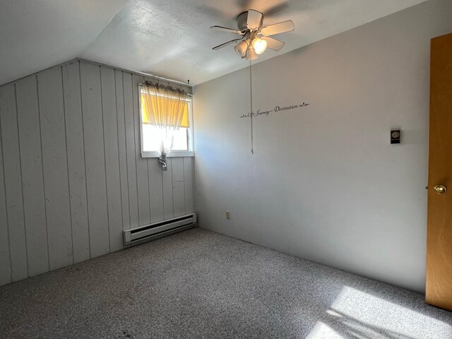 214 Church St, Thompson Falls, MT 59873 - additional living space with a baseboard heating unit, wooden walls, a ceiling fan, lofted ceiling, and carpet floors