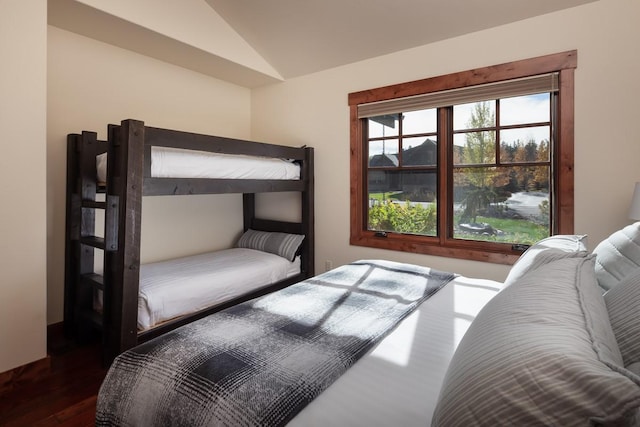 628 Nature Trl, Whitefish, MT 59937 - bedroom featuring vaulted ceiling and wood finished floors