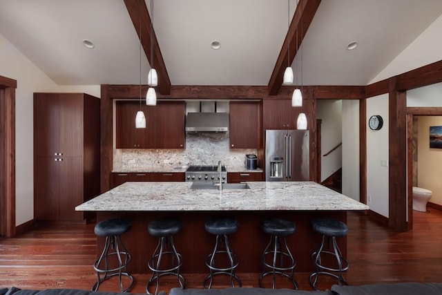 628 Nature Trl, Whitefish, MT 59937 - kitchen featuring range hood, high quality fridge, dark wood-style flooring, and tasteful backsplash