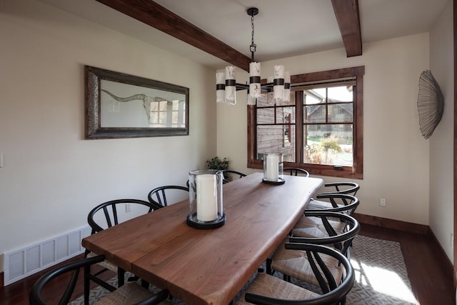 628 Nature Trl, Whitefish, MT 59937 - dining area featuring a chandelier, beamed ceiling, and wood finished floors
